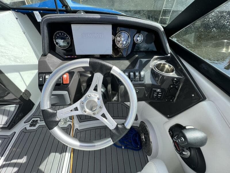 Cockpit of 2022 Monterey M-45 boat with steering wheel and control panel.