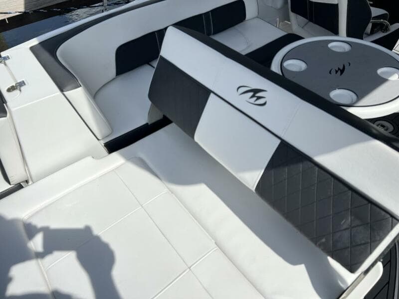 2022 Monterey M-45 boat interior with white and black seating and cup holders.