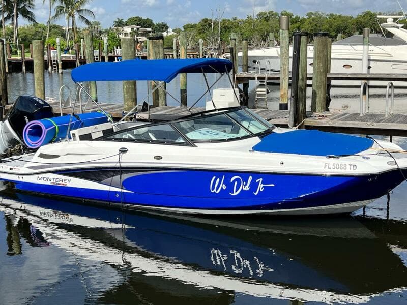 Blue and white 2022 Monterey M-45 boat docked at marina.