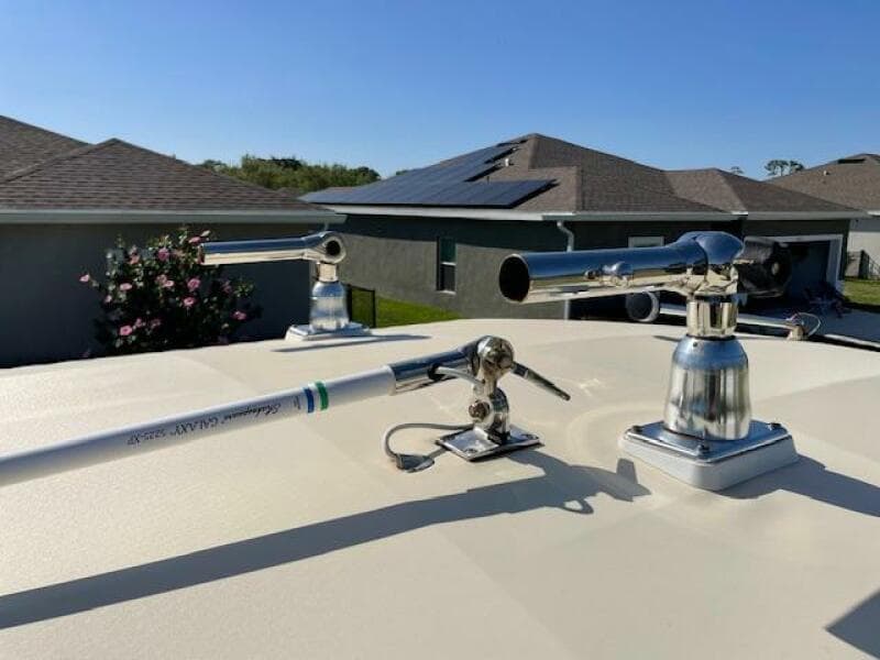 2014 Grady-White Fisherman 257 boat with mounted fishing rod holders.