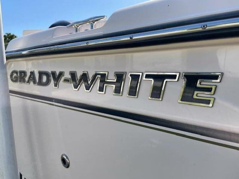 2014 Grady-White Fisherman 257 boat side view with logo.