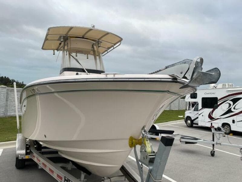 2014 Grady-White Fisherman 257 boat on trailer in parking lot.