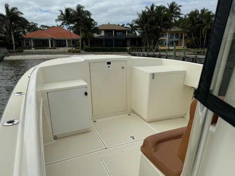 2004 Intrepid 32 Cuddy boat interior with seating and storage compartments.