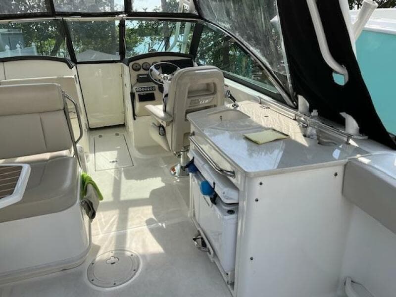 2018 Boston Whaler 270 Vantage boat interior with helm, seating, and storage.