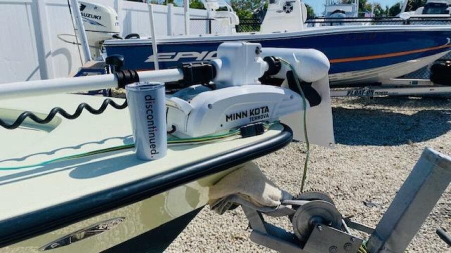 1983 Maverick 18 Flats Boat with Minn Kota trolling motor in a boatyard.