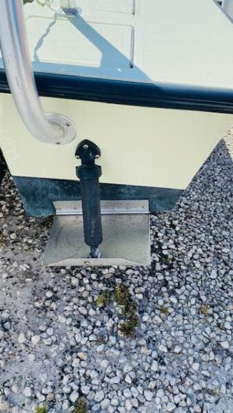 1983 Maverick 18 Flats Boat stern detail on gravel surface.