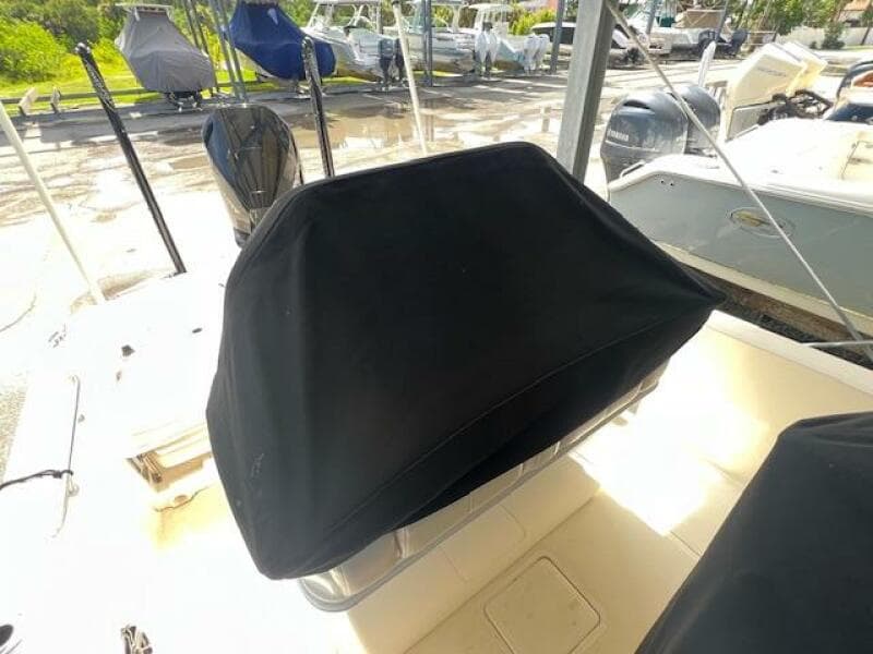 2023 Boston Whaler 250 Dauntless boat with covered seating area.