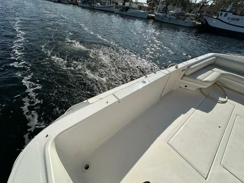 1997 Sea Ray 550 Sedan Bridge boat deck with water view.