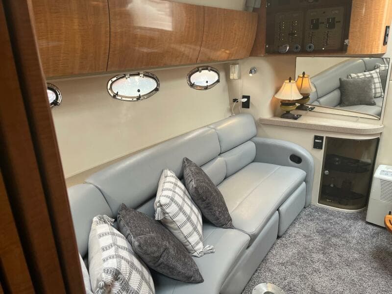 Luxurious interior of 2003 Regal Commodore 3860 yacht with plush seating and elegant decor.