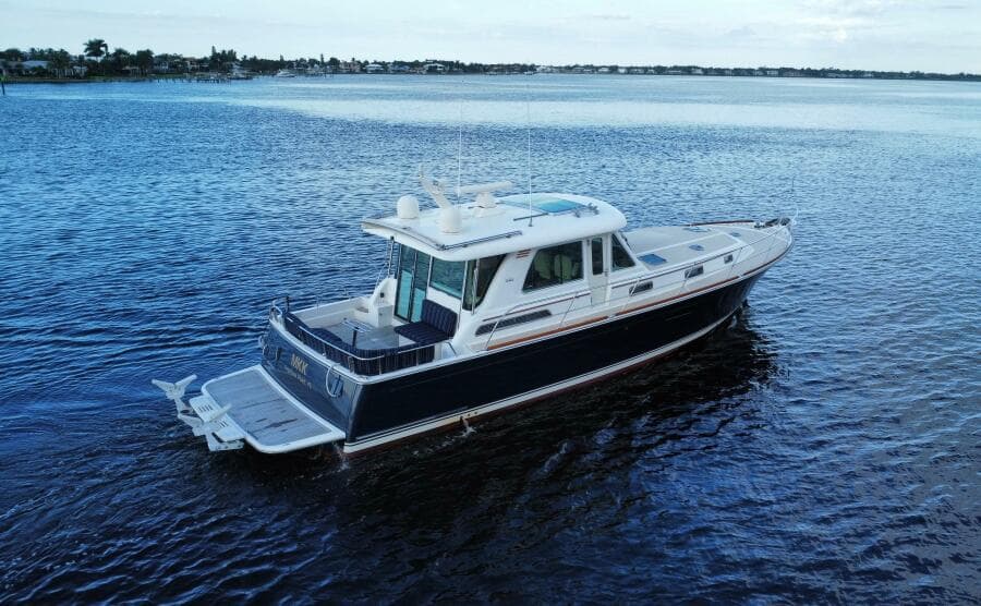 2013 Sabre 48 Salon Express yacht cruising on calm waters.