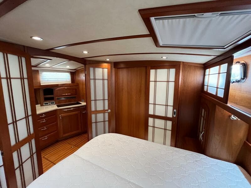 Luxurious interior of 2013 Sabre 48 Salon Express yacht with wood paneling and modern amenities.