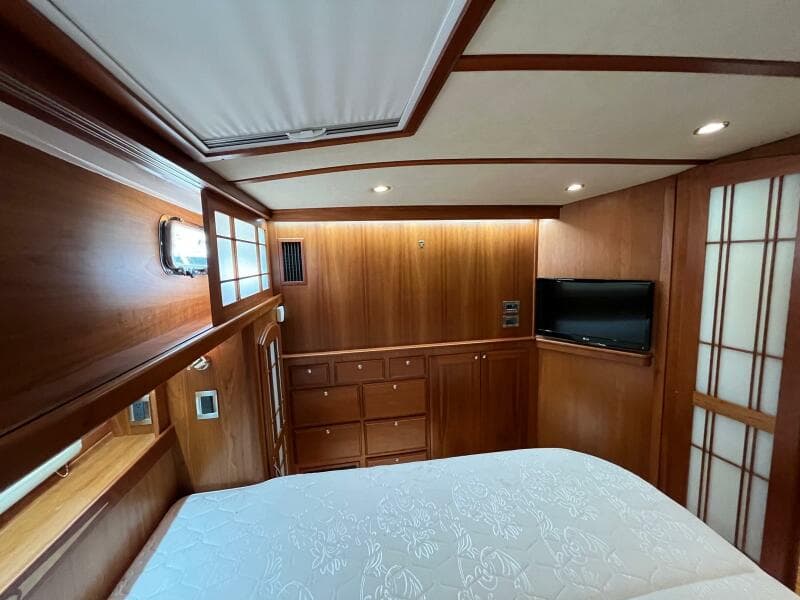 Luxurious wood-paneled cabin interior of 2013 Sabre 48 Salon Express yacht.