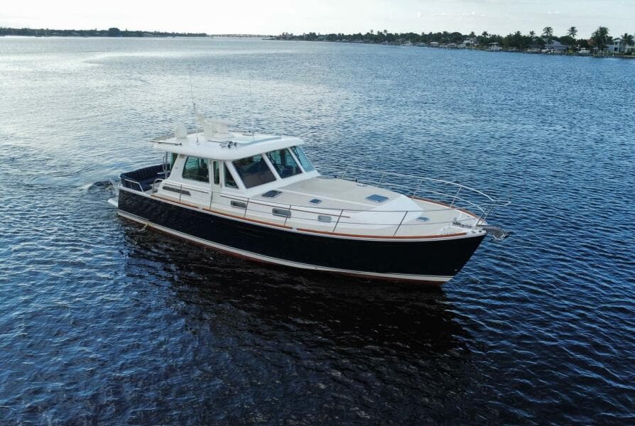 2013 Sabre 48 Salon Express yacht cruising on open water.