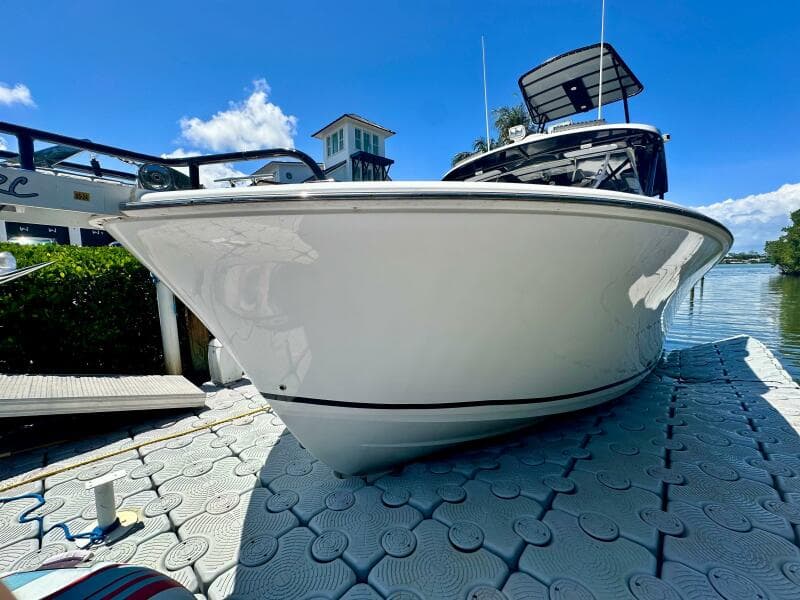 2000 Luhrs Tournament 320 Open boat docked on a sunny day.