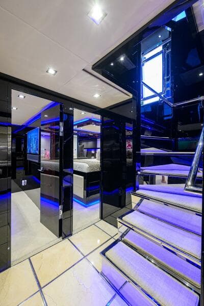 Luxurious interior of 1997 Broward 108 Raised Pilothouse yacht with modern lighting and sleek design.