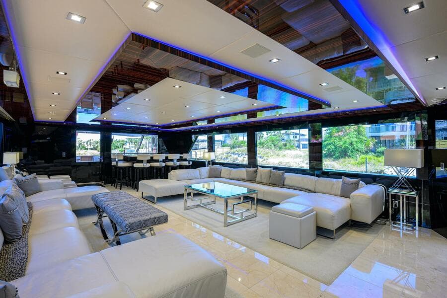 Luxurious interior of 1997 Broward 108 Raised Pilothouse yacht with modern furnishings.