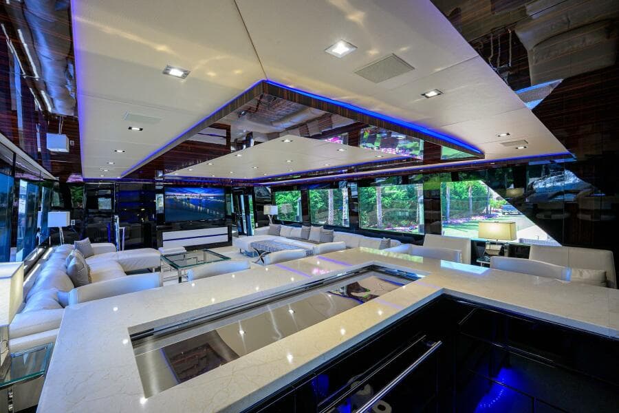 Luxurious interior of 1997 Broward 108 Raised Pilothouse yacht with modern design and ample seating.