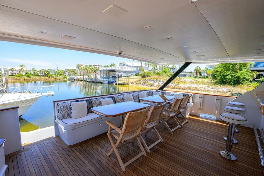 Luxury outdoor seating area on a 1997 Broward 108 Raised Pilothouse yacht.