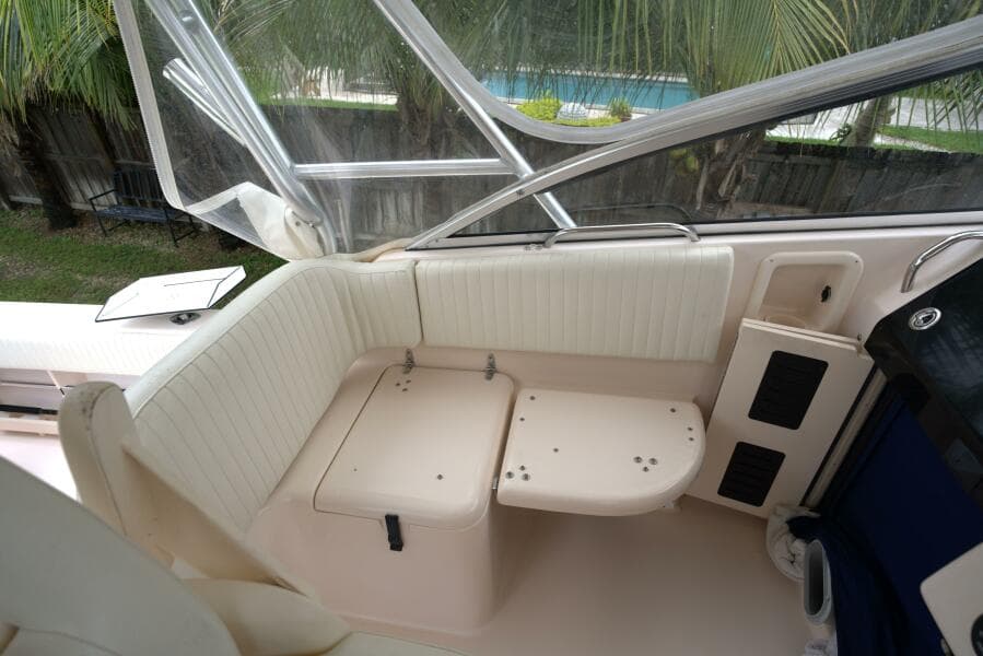 2007 Grady-White Express 330 boat interior seating area with white upholstery.