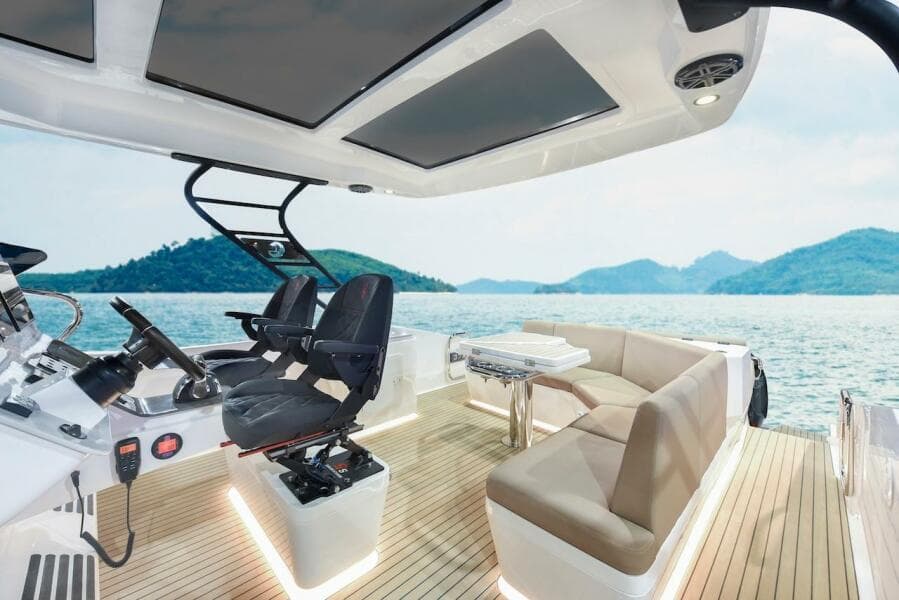 2024 Oryx 379 boat interior with luxurious seating and scenic ocean view.