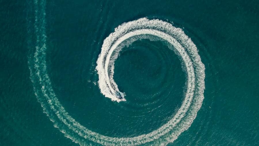 Aerial view of Oryx 379 boat making circular waves in the ocean, 2024 model.