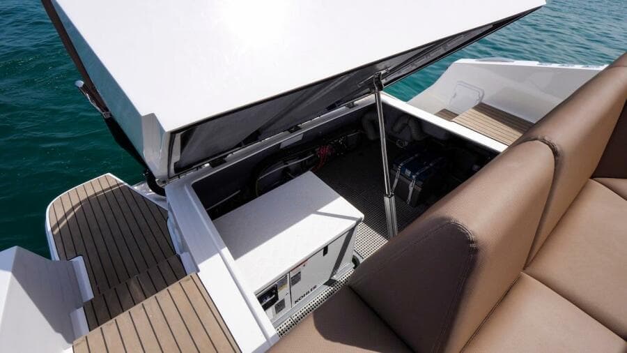 2024 Oryx 379 boat with open engine compartment and brown seating.