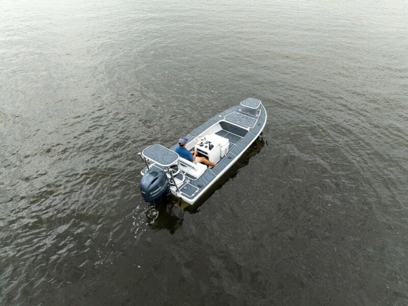 2025 BlueZones Boatworks 16' Flats on calm water, aerial view.