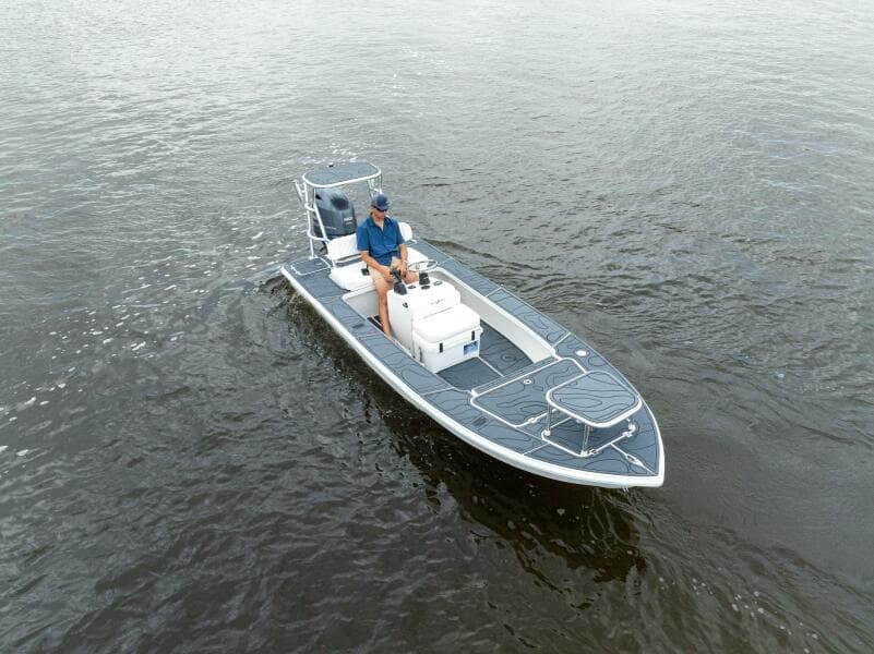 2025 BlueZones Boatworks 16' Flats boat on water, featuring sleek design and modern features.