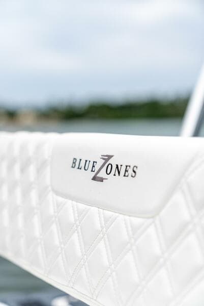 Close-up of BlueZones Boatworks 2025 16' Flats boat seat with logo.