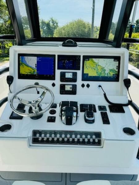 2022 Invincible 36 Open Fisherman boat dashboard with advanced navigation and control systems.