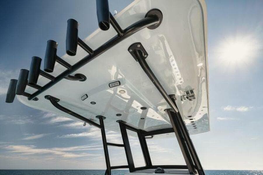Invincible 36 Open Fisherman 2022 boat, view of T-top and rod holders against blue sky.
