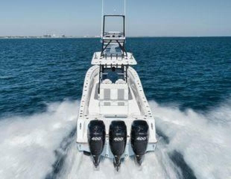 2022 Invincible 36 Open Fisherman boat speeding on open water.