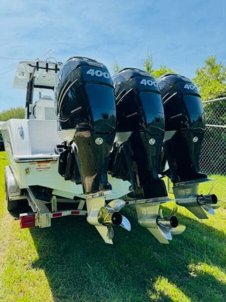 2022 Invincible 36 Open Fisherman with triple 400 horsepower engines on a trailer.