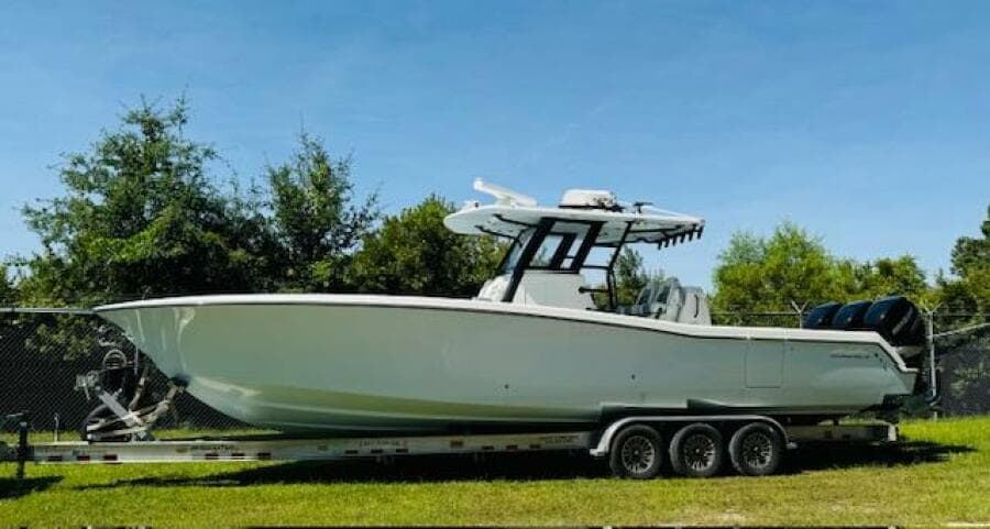 2022 Invincible 36 Open Fisherman boat on trailer, parked outdoors.