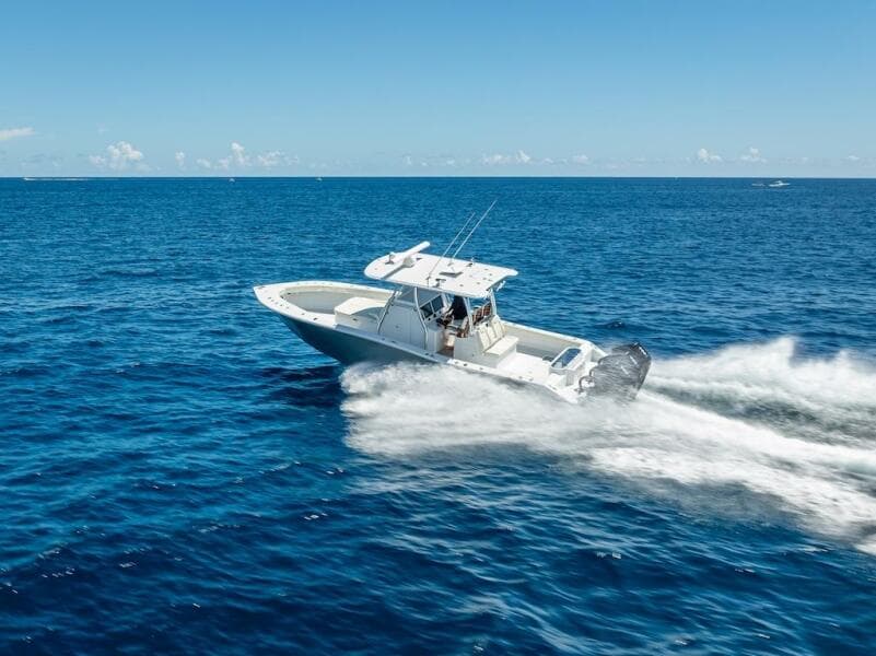 2025 Billfish 39 Center Console boat speeding on open ocean.