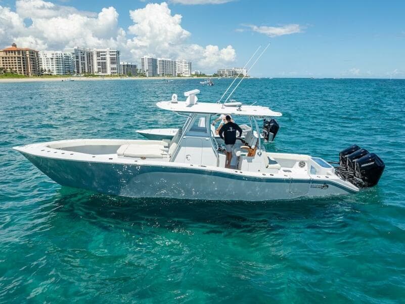 2025 Billfish 39 Center Console boat on clear blue ocean near city skyline.