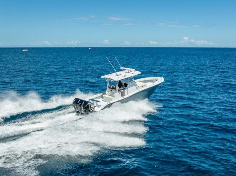 2025 Billfish 39 Center Console boat speeding on open ocean.