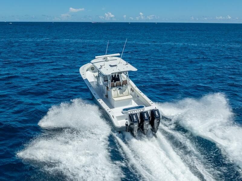 2025 Billfish 39 Center Console boat speeding on open ocean.