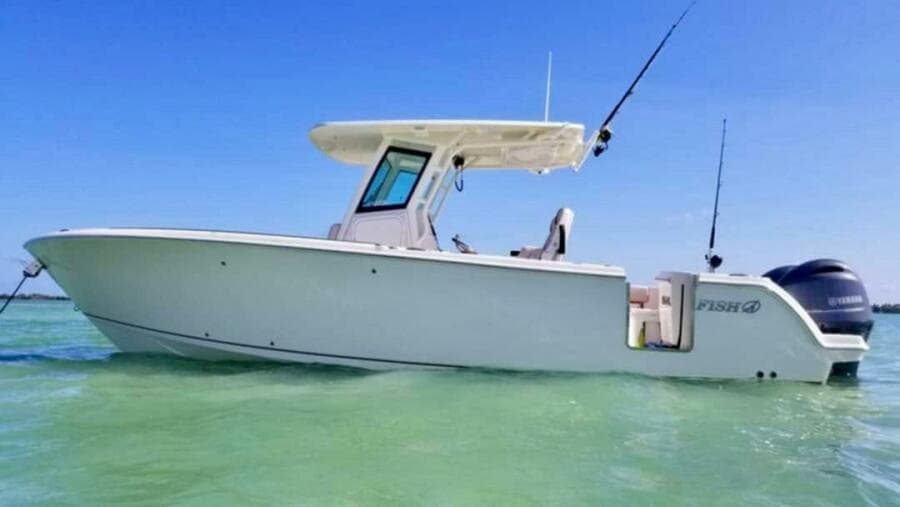 2021 Sailfish 272 CC boat on clear water under blue sky.