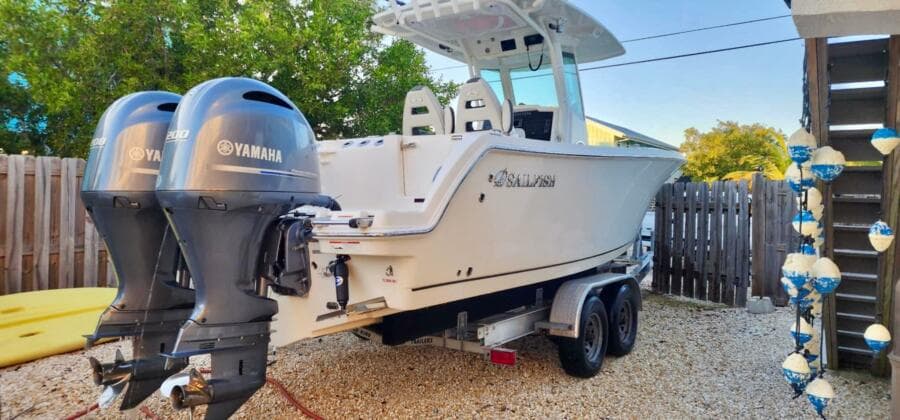 2021 Sailfish 272 CC boat with dual Yamaha engines on a trailer.