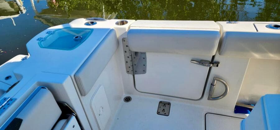 2021 Sailfish 272 CC boat interior with seating and storage compartments.