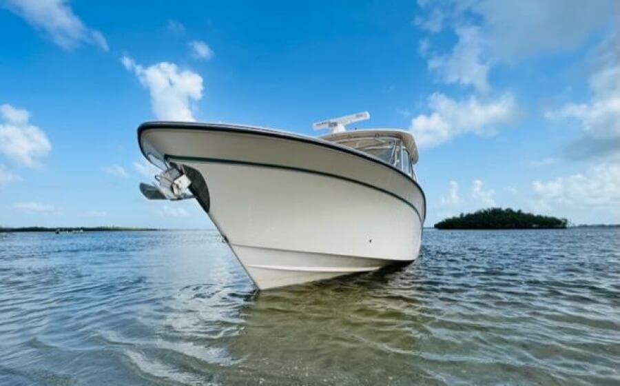 2014 Grady-White Freedom 335 boat anchored in shallow water.