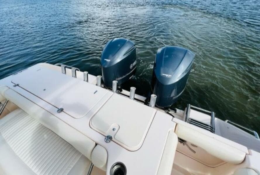 2014 Grady-White Freedom 335 boat with twin outboard engines on water.