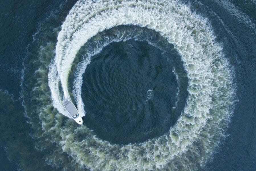 Aerial view of 2023 Real 35 Special Deck (SD) boat making a circular wake pattern.