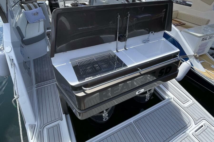 Real 35 Special Deck (SD) 2023 boat with open rear deck and built-in grill.