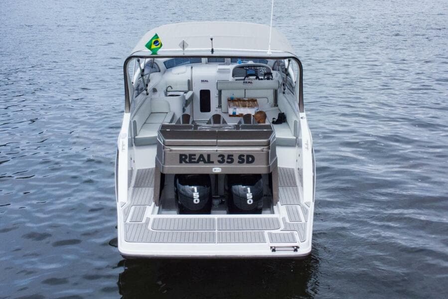 2023 Real 35 Special Deck (SD) boat on water, rear view.