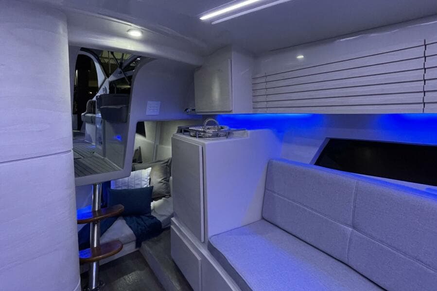 Modern interior of 2023 Real 35 Special Deck (SD) boat with blue LED lighting.