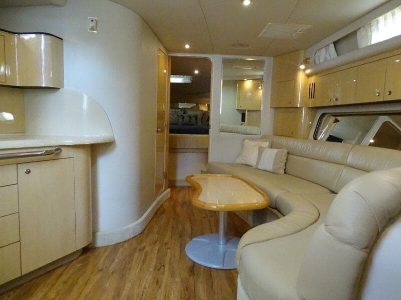 Interior of 2001 Sea Ray 410 Sundancer yacht with modern furnishings.