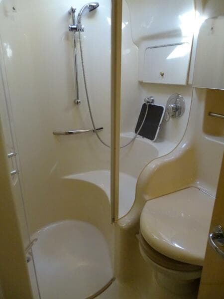 2001 Sea Ray 410 Sundancer bathroom with shower and toilet.