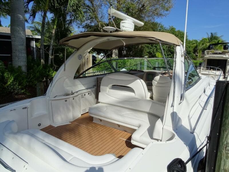 2001 Sea Ray 410 Sundancer boat with spacious deck and seating area.